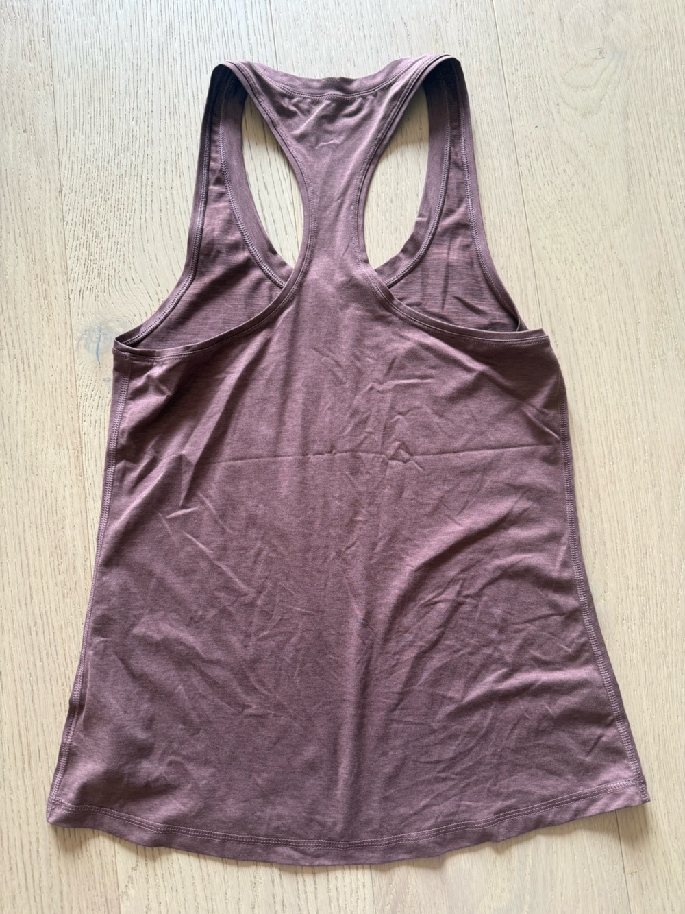 Vuori Women's Sleeveless Racerback Tank in burnt orange